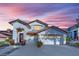 Beautiful two-story home with stucco facade, tile roof, and three-car garage at 9705 Cameo Rose Ln, Las Vegas, NV 89134