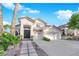 Attractive home boasting a spacious driveway, three-car garage, and manicured front garden at 9705 Cameo Rose Ln, Las Vegas, NV 89134