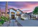Stunning two-story home with landscaped front yard, tile roof, and a two-car garage at 9705 Cameo Rose Ln, Las Vegas, NV 89134