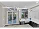 Bright kitchen featuring stainless appliances, modern lighting, and access to an outdoor patio at 9705 Cameo Rose Ln, Las Vegas, NV 89134