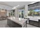 Open-concept kitchen with a large island, ample cabinet space, and stainless steel appliances at 9705 Cameo Rose Ln, Las Vegas, NV 89134