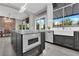 Bright kitchen featuring an island, stainless steel appliances, and a breakfast bar area at 9705 Cameo Rose Ln, Las Vegas, NV 89134