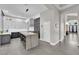 Bright, open kitchen with a large island, stainless steel appliances, and modern finishes at 9705 Cameo Rose Ln, Las Vegas, NV 89134