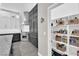 Kitchen showcasing stainless steel appliances, custom cabinetry, and a walk-in pantry at 9705 Cameo Rose Ln, Las Vegas, NV 89134