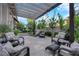 Inviting backyard patio seating area with woven chairs and a pergola at 9705 Cameo Rose Ln, Las Vegas, NV 89134