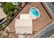 Aerial view of a single Gathering home with a tile roof, fenced in yard, and swimming pool at 10290 Marion Morrison Ct, Las Vegas, NV 89183