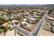 An expansive aerial view showcases the neighborhood layout, nearby streets and surrounding desert landscape at 10290 Marion Morrison Ct, Las Vegas, NV 89183