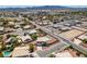 Aerial view of the neighborhood featuring many single Gathering homes and desert landscaping at 10290 Marion Morrison Ct, Las Vegas, NV 89183
