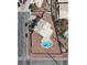 Aerial view of property showcasing a refreshing pool, set on a spacious lot in a desirable neighborhood at 10290 Marion Morrison Ct, Las Vegas, NV 89183