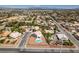 An expansive aerial view showcases the neighborhood layout, nearby streets and surrounding desert landscape at 10290 Marion Morrison Ct, Las Vegas, NV 89183