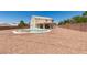 Beautiful backyard with a pool, desert landscaping, and covered patio, perfect for outdoor living at 10290 Marion Morrison Ct, Las Vegas, NV 89183