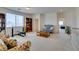 A third bonus room featuring comfortable furniture and open space with natural lighting at 10290 Marion Morrison Ct, Las Vegas, NV 89183
