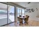 Bright breakfast nook features backyard pool view and dining area for four at 10290 Marion Morrison Ct, Las Vegas, NV 89183