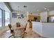 Bright dining area adjacent to the kitchen with large windows overlooking the backyard and providing ample natural light at 10290 Marion Morrison Ct, Las Vegas, NV 89183