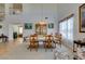 Open-concept living and dining areas feature high ceilings, large windows, and seamless transitions to the kitchen at 10290 Marion Morrison Ct, Las Vegas, NV 89183