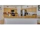 Spacious kitchen featuring granite countertops, stainless steel appliances, and ample cabinet space, adjacent to informal dining area at 10290 Marion Morrison Ct, Las Vegas, NV 89183