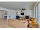 Open-concept living room features a fireplace and lots of natural light at 10290 Marion Morrison Ct, Las Vegas, NV 89183