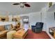 Comfortable living room with neutral paint, tile floors and natural light at 10290 Marion Morrison Ct, Las Vegas, NV 89183