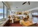 Open-concept living room with access to breakfast nook, kitchen, and pool at 10290 Marion Morrison Ct, Las Vegas, NV 89183