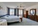Spacious main bedroom with neutral tones, ample natural light, and comfortable furnishings at 10290 Marion Morrison Ct, Las Vegas, NV 89183