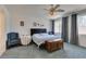 Serene bedroom featuring plush carpeting, natural light, and cozy seating area at 10290 Marion Morrison Ct, Las Vegas, NV 89183
