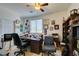 Comfortable home office space with a desk, office chairs, and shelving at 10290 Marion Morrison Ct, Las Vegas, NV 89183