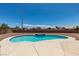 Backyard pool featuring desert landscaping, a tiled spa, and clear blue skies above at 10290 Marion Morrison Ct, Las Vegas, NV 89183