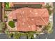 Aerial view of home featuring a red tile roof and a neatly landscaped yard with small patches of vibrant green grass at 10294 Running Falls St, Las Vegas, NV 89178