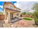 Relaxing backyard offering a covered patio, low maintenance landscaping, and a cozy outdoor dining area at 10294 Running Falls St, Las Vegas, NV 89178