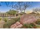 A landscaped entrance with rock signage welcomes you to The Club at Yellowstone at 10294 Running Falls St, Las Vegas, NV 89178