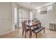 Dining room filled with natural light and featuring a wooden table with bench seating at 10294 Running Falls St, Las Vegas, NV 89178