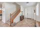 Bright entryway showcasing a staircase, tile flooring, and a coat closet for storage at 10294 Running Falls St, Las Vegas, NV 89178