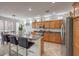 Spacious kitchen featuring granite countertops, stainless steel appliances, and an island with seating at 10294 Running Falls St, Las Vegas, NV 89178
