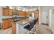 Kitchen with granite countertops, an island with seating, and stainless steel appliances at 10294 Running Falls St, Las Vegas, NV 89178