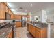 Updated kitchen featuring stainless steel appliances, granite countertops, and wooden cabinetry at 10294 Running Falls St, Las Vegas, NV 89178