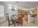 Bright eat-in kitchen featuring stainless steel appliances, granite countertops and wooden cabinetry at 10294 Running Falls St, Las Vegas, NV 89178