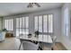 Contemporary dining room with modern furnishings and window shutters, offering an elegant and comfortable space at 10389 Felice Ave, Las Vegas, NV 89135