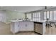 Spacious kitchen featuring a large island with stainless steel dishwasher and view of adjacent living area at 10389 Felice Ave, Las Vegas, NV 89135