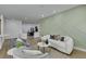 Bright living room area featuring hardwood floors, a modern wall accent, and modern decor at 10389 Felice Ave, Las Vegas, NV 89135