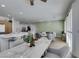 Open-concept living area showcasing the dining area, kitchen island, and a cozy seating area in a modern design at 10389 Felice Ave, Las Vegas, NV 89135