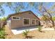 The backyard showcases desert landscaping, a concrete patio, and lush shrubs, ideal for relaxing or entertaining at 10482 Clarion River Dr, Las Vegas, NV 89135