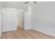 Bedroom featuring neutral paint, base trim and light hardwood floors at 10482 Clarion River Dr, Las Vegas, NV 89135