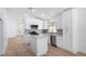 Stylish kitchen features white cabinets, marble counters, stainless appliances, and grey backsplash at 10482 Clarion River Dr, Las Vegas, NV 89135