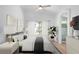 Bedroom with ceiling fan, neutral decor, and ensuite bathroom at 10482 Clarion River Dr, Las Vegas, NV 89135