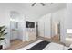 Bright main bedroom showcasing an ensuite bathroom and ample closet space, and light hardwood floors at 10482 Clarion River Dr, Las Vegas, NV 89135