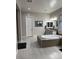 Bathroom featuring a modern tub, double vanities, and granite countertops at 11318 San Arezzo Pl, Las Vegas, NV 89141