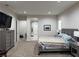 Bedroom boasts neutral carpet, ensuite bathroom, and modern furnishings at 11318 San Arezzo Pl, Las Vegas, NV 89141