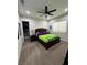 Bedroom with a walk-in closet, ceiling fan, and carpet flooring at 11318 San Arezzo Pl, Las Vegas, NV 89141