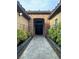 Charming stone walkway leads to the elegant double door entrance with stone surround at 11318 San Arezzo Pl, Las Vegas, NV 89141