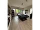 Spacious game room with pool table, pinball machine, and natural light at 11318 San Arezzo Pl, Las Vegas, NV 89141